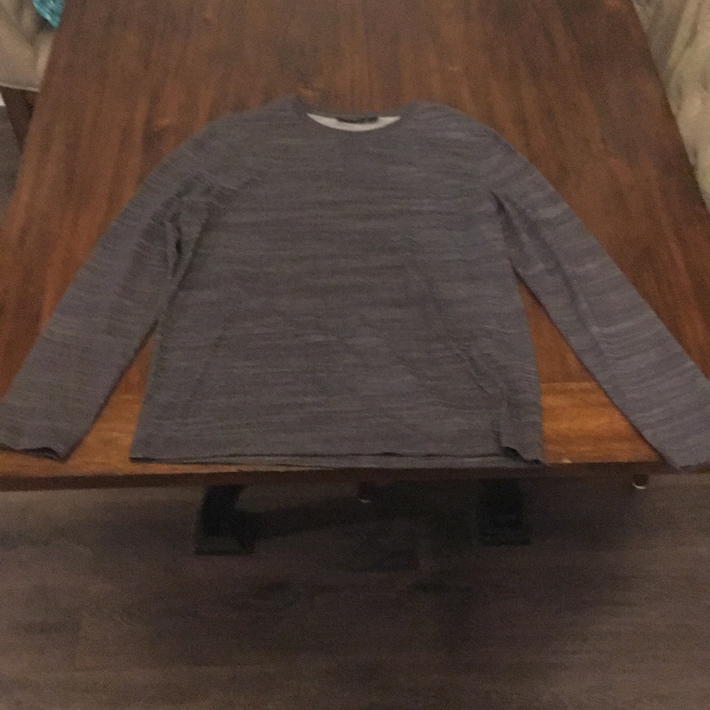 Long sleeve black and grey shirt.